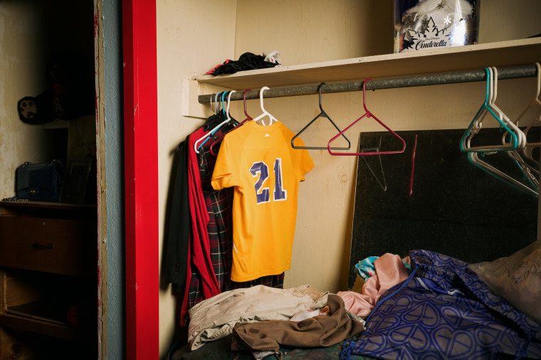 An old baseball jersey belonging to Rebecca McDonald’s son hangs in his empty bedroom in Glenmora, La.