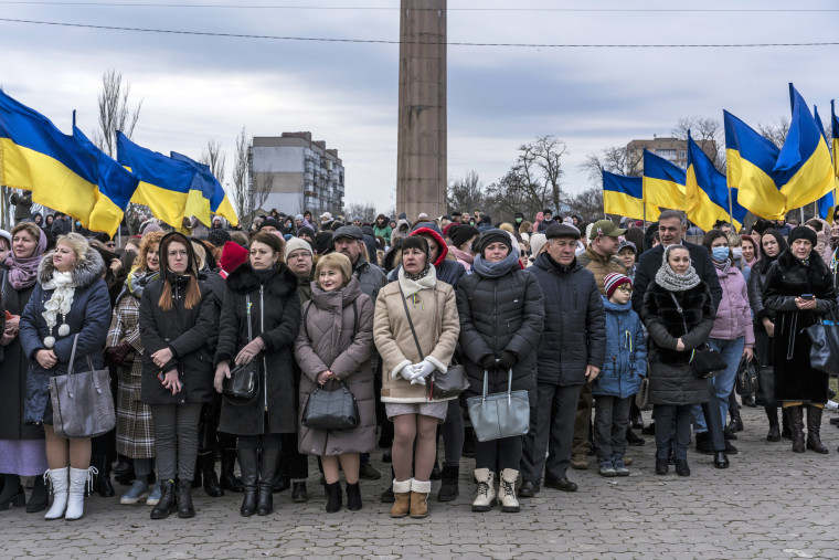 People gather for a ceremony to mark Unity Day in Kherson, Ukraine, on Wednesday, Feb. 16, 2022. (Brendan Hoffman/The New York Times)