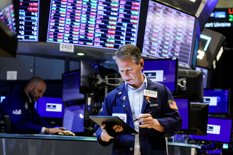 Traders work on the floor of the New York Stock Exchange in New York on March 10, 2022.
