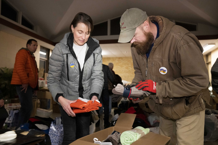 Jonathan Pylypiv helps load a truck with medical and relief items.