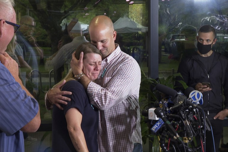 Nichole Schmidt, the mother of Gabby Petito, is comforted by her husband, Jim Schmidt, during a news conference on Sept. 28, 2021, in Bohemia, N.Y.