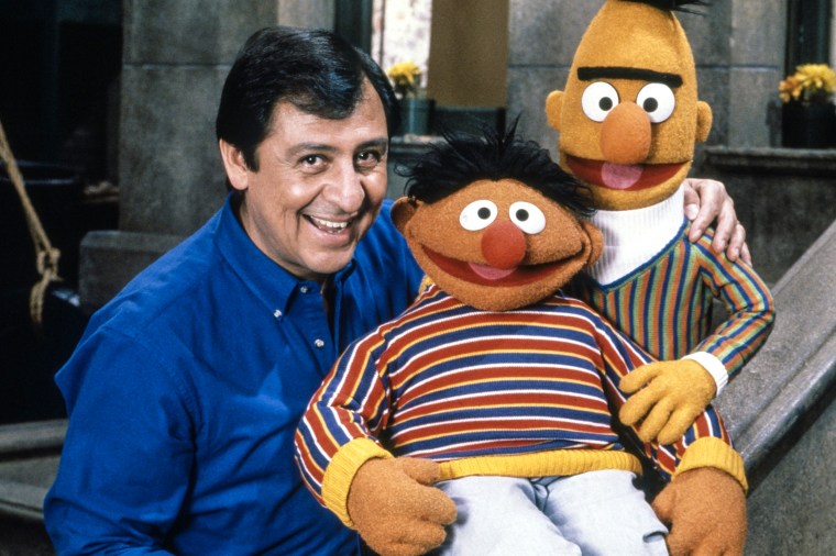 Emilio Degado, Ernie voiced by Jim Henson, and Bert voiced by Frank Oz on Sesame Street in the 1990s.