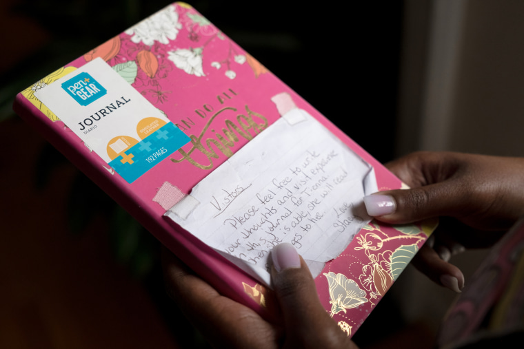 Tionna Hairston holds the diary her mother left in the hospital room for visitors.