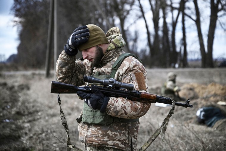 A Ukrainian serviceman holds a weapon