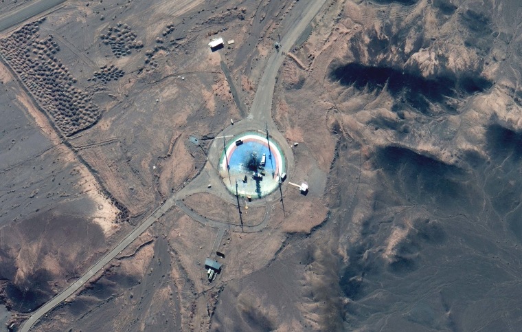 In this satellite photo from Maxar Technologies, trucks and other equipment surround a scorched launch pad at Iran's Imam Khomeini Spaceport in rural Semnan province on Feb. 27.