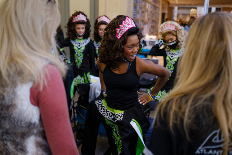 Imani Johnson tries on an outfit at competition.