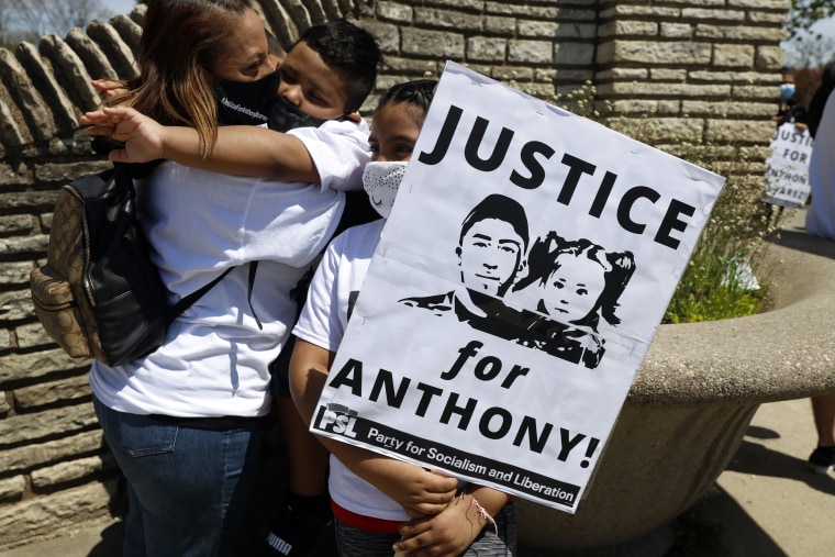 A family embraces during a protest honoring the life of police shooting victim Anthony Alvarez on May 1, 2021 in Chicago's Portage Park.