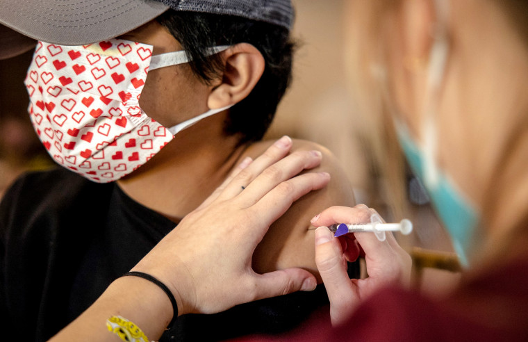 A man receives a Covid-19 vaccination dose at a vaccine clinic in San Antonio, Texas, on Jan. 9, 2022.
