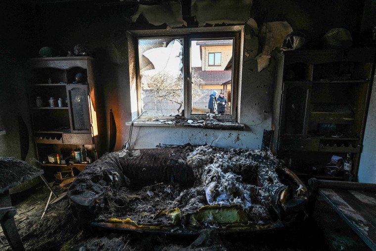 A private home is damaged by shelling in the Osokorky district in southeastern Kyiv on March 15, 2022.