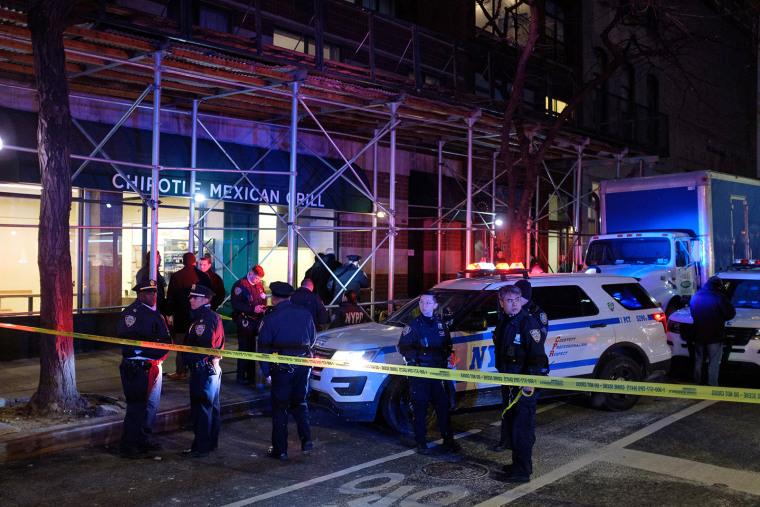 Police investigate after a homeless man was found shot to death on Murray Street and Greenwich Street in New York City on March 13, 2022.