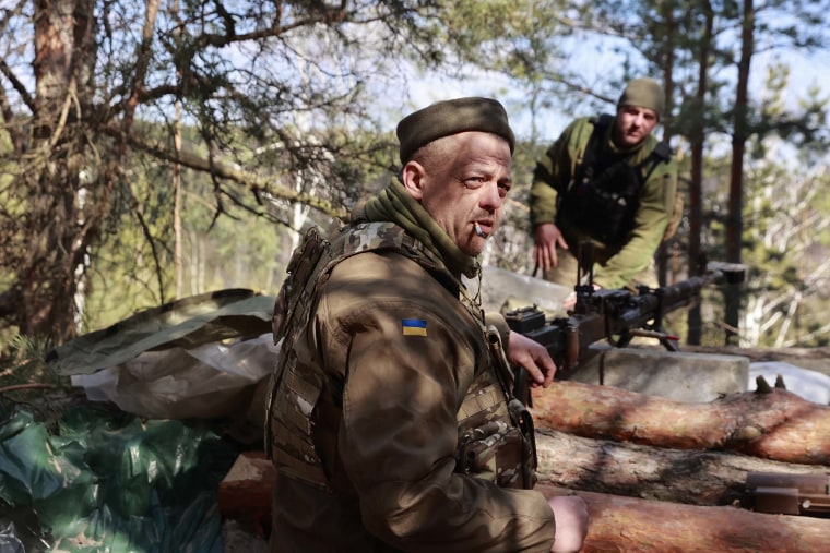 Ukrainian servicemen guard their position near Brovary, north of Kyiv, Ukraine, Thursday, March 17.
