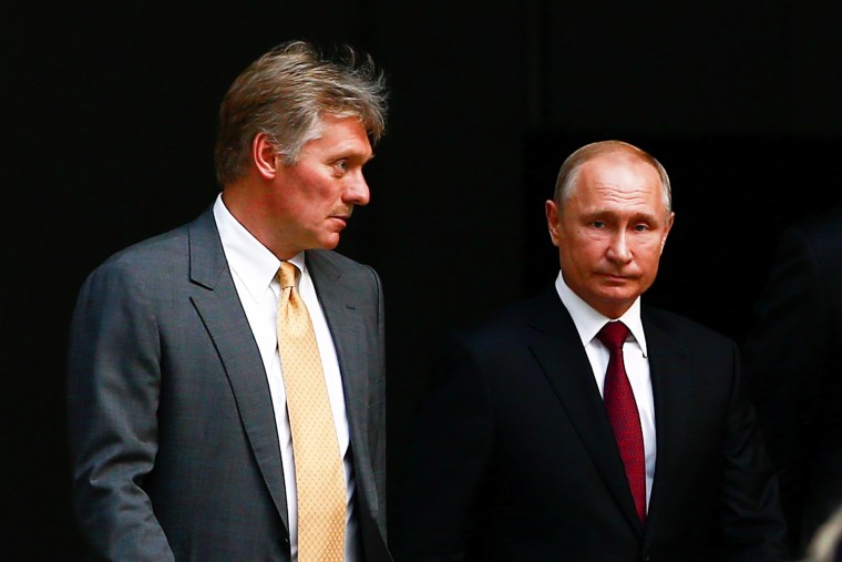 Russian President Vladimir Putin and Russian Presidential Spokesman Dmitry Peskov (L) arrive for Putin's annual Question and Answer session in Moscow on June 20, 2019.