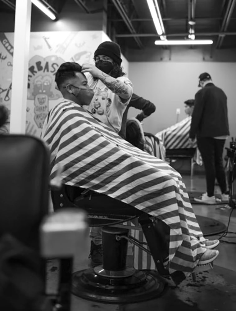 Ru Arana, a nonbinary barber at The Barbashop in Austin, Texas.