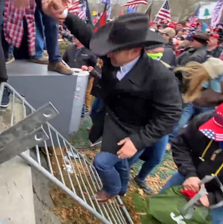 Couy Griffin enters the area immediately beneath the inauguration platform near the Capitol on Jan. 6, 2021.