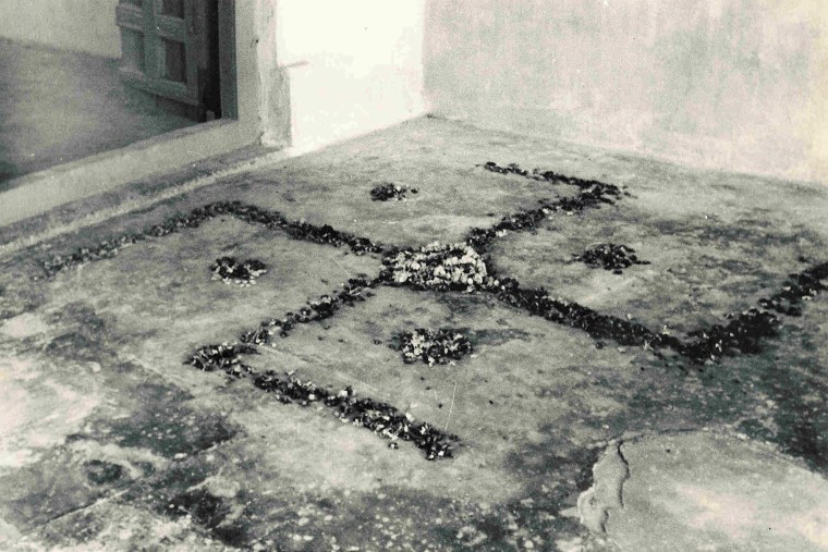 The spot in Porbandar, India, where Mahatma Gandhi was born. In Hinduism, the swastika represents the four directions. Facing right, it represents the evolution of the universe; facing left, it represents the involution of the universe. Hindus consider the swastika both holy and auspicious and use it to decorate cultural items.