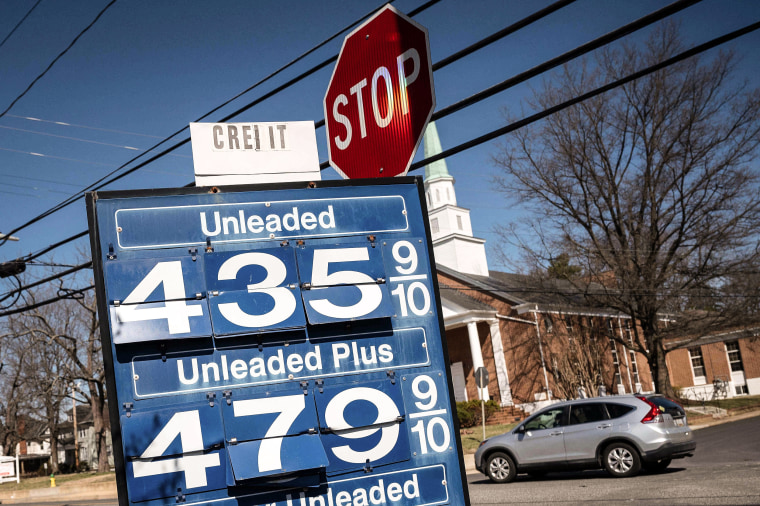 Image: A car passes a gas station sign in Annapolis, Md., on March 14, 2022.