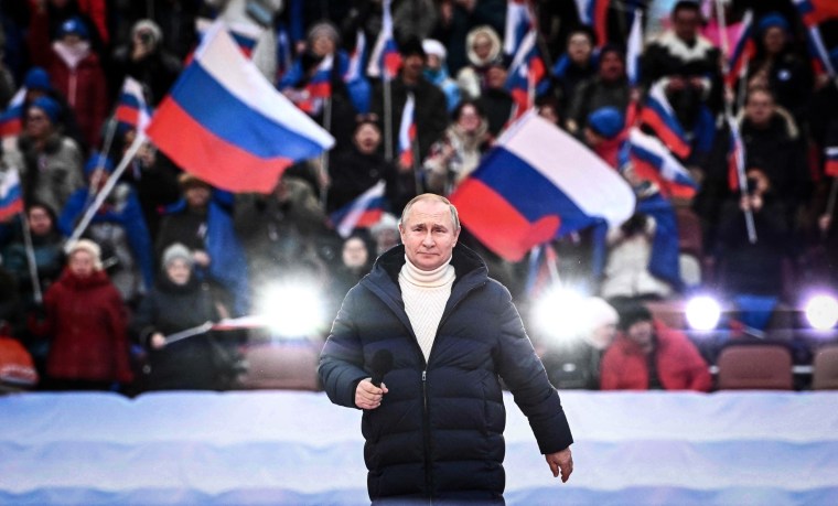 Image: Russian President Vladimir Putin attends a concert marking the eighth anniversary of Russia's annexation of Crimea at the Luzhniki stadium in Moscow on March 18, 2022.