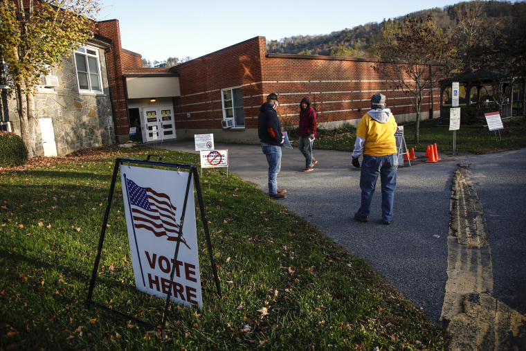 A voter makes his way into a polling place to cast his ballot in the early morning at the Valle Crucis School on Nov. 3, 2020 in Sugar Grove, N.C.