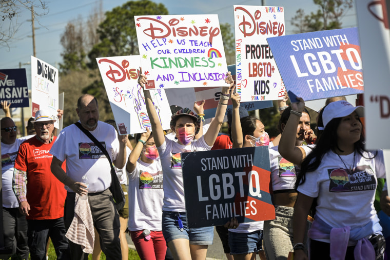 Image: Advocates march at a rally at the Walt Disney Company in Orlando, Fla., spearheaded by advocates from AIDS Healthcare Foundation on March 3, 2022.