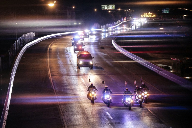 Image: Police form a procession on I-95 in Philadelphia early Monday, March 21, 2022, for two Pennsylvania State troopers who were killed in a multi-vehicle collision that occurred on I-95 southbound in South Philadelphia.