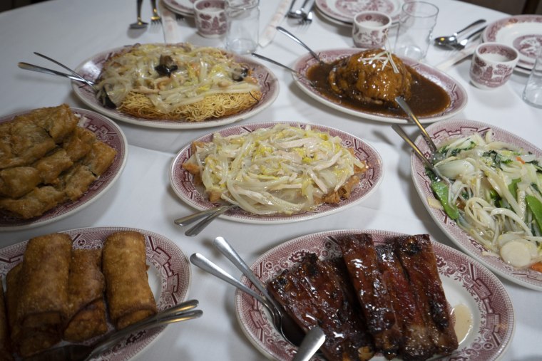 A Cantonese-American style meal including chop suey, chow mein and egg rolls at Hop lee In New York City’s Chinatown.