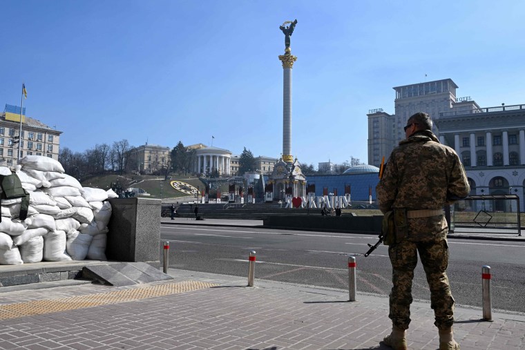 Image: A Ukrainian serviceman stands guard at Independence Square
