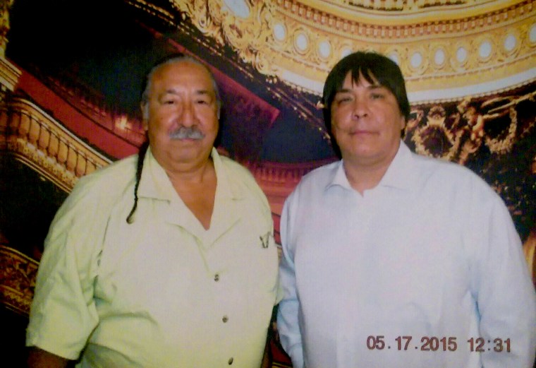 Image: Leonard Peltier and his son, Chauncey, during a visit in prison in 2015.