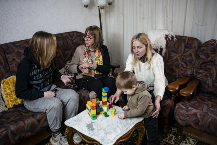 Ukrainian refugees sit in a home of a resident in the village of Guissona, Lleida, Spain, on March 17, 2022.