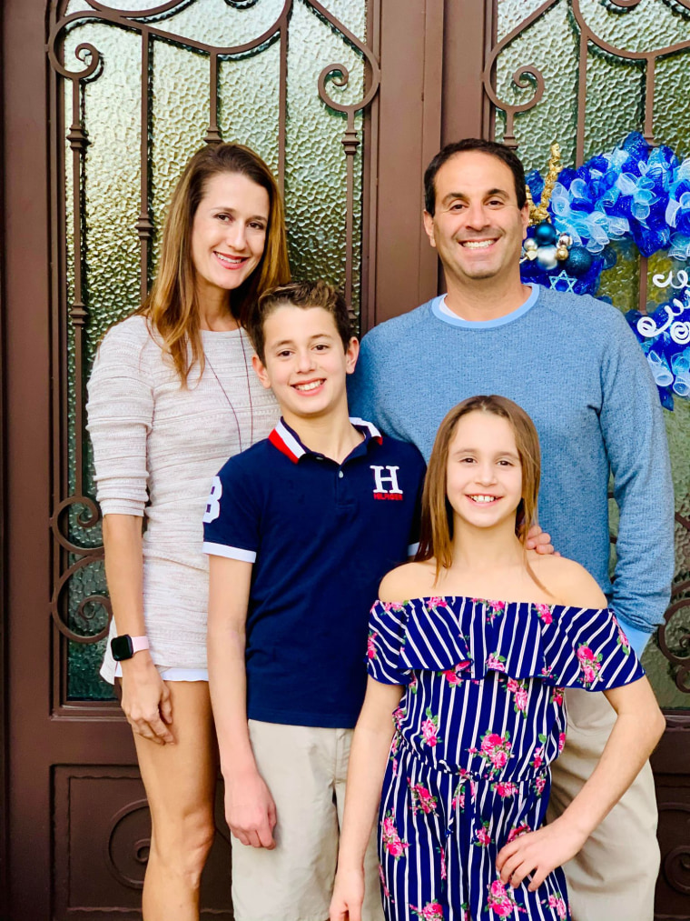 Pediatric nurse practitioner Janet Semenova-Hornstein is shown with her husband and two children.