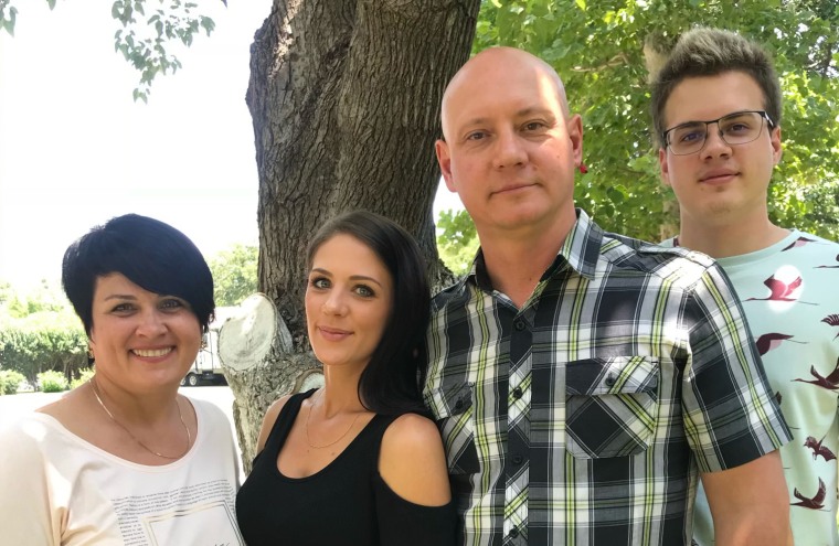 Pastor Dmitry Bodyu, third from left, with his family.