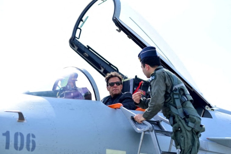 Image: Pakistan's Prime Minister Imran Khan sits in the cockpit of the Chinese J-10 C combat aircraft during the induction ceremony in Kamra