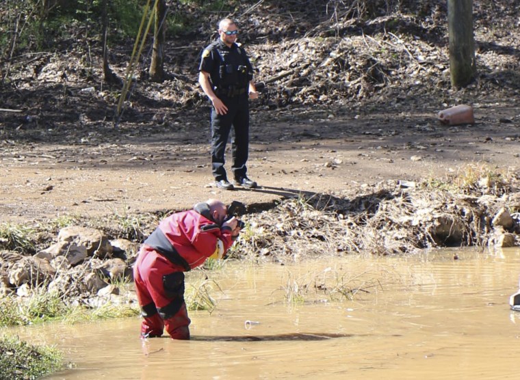 the scene where three bodies were found in receding floodwaters in Tuscaloosa