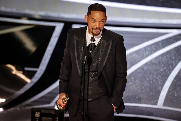 Will Smith accepts the best actor in a leading role award for "King Richard" onstage during the Academy Awards in Los Angeles on Sunday.