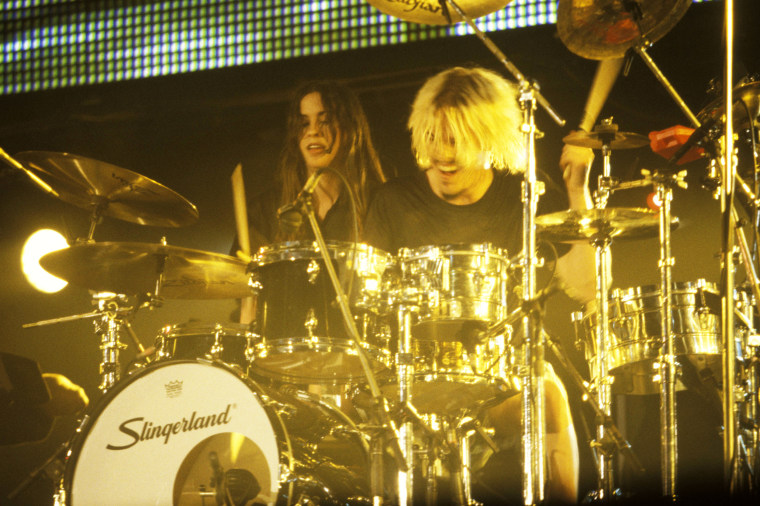 Alanis Morissette performs with Taylor Hawkins circa 1995.