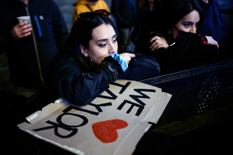 Foo Fighters fans weep at the Stereo Picnic festival in Bogotá, Colombia, on March 25, 2022, following the death of the band's drummer Taylor Hawkins.