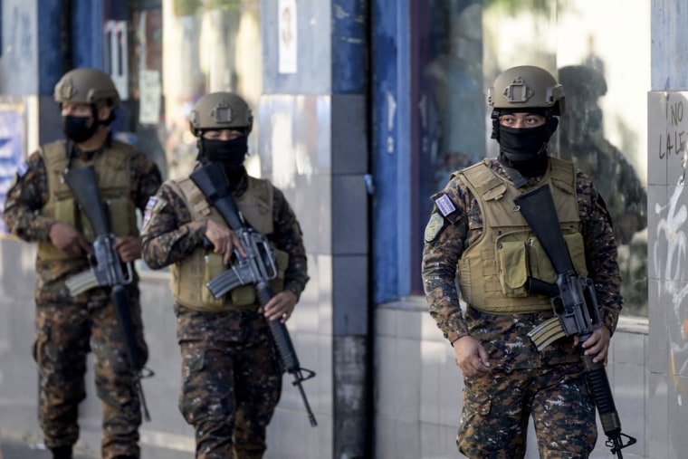 Salvadorean soldiers patrol the streets following the government's declaration of state of emergency, in San Salvador, on March 27, 2022.
