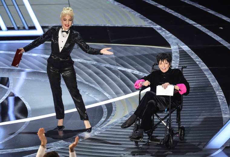 Lady Gaga and Liza Minnelli speak onstage during the Academy Awards in Los Angeles on Sunday.