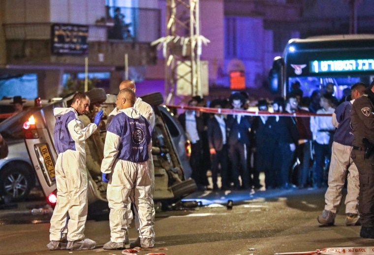 Image: Israeli security forces and emergency personnel gather at the scene of a shooting attack on March 29, 2022 in Bnei Brak.