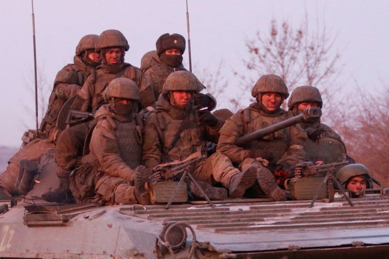 Image: Service members of pro-Russian troops are seen near the besieged city of Mariupol