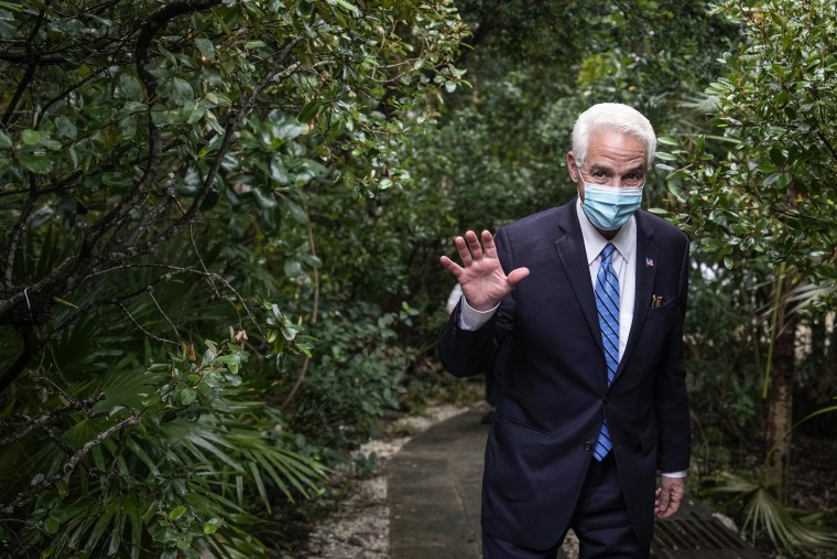 U.S. Rep. Charlie Crist, D-Fla, waves as he arrives at a home to meet with a group of local activists, business people, and community leaders, on Feb. 9, 2022, in Hollywood, Fla.