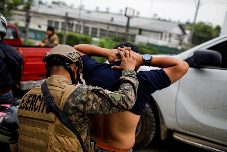 A soldier searches a man at a checkpoint at the 22 de Abril neighborhood after a declaration of a state of emergency in Soyapango, El Salvador, on March 29, 2022.