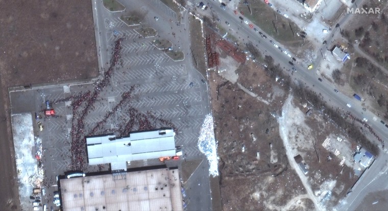 Image: A satellite image shows a closer view of crowds outside a Metro grocery store, in Mariupol