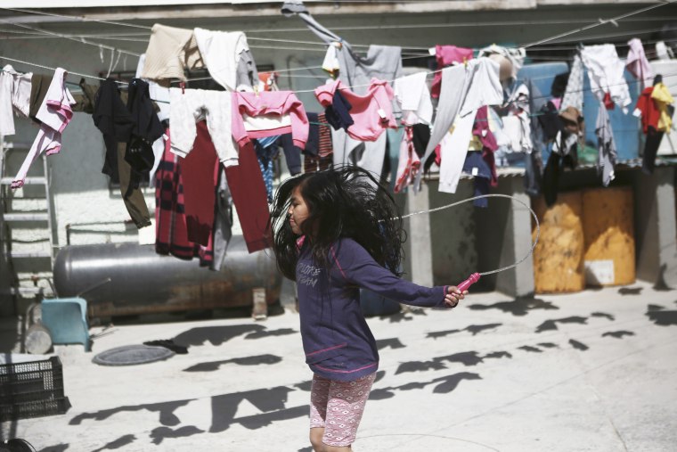 A child jumps rope in the courtyard of the Good Samaritan shelter