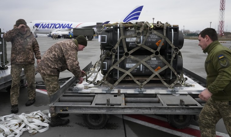 Ukrainian servicemen unpack a shipment of military aid delivered as part of the U.S. security assistance to Ukraine, at the Boryspil airport, outside Kyiv, on Feb. 11. 
