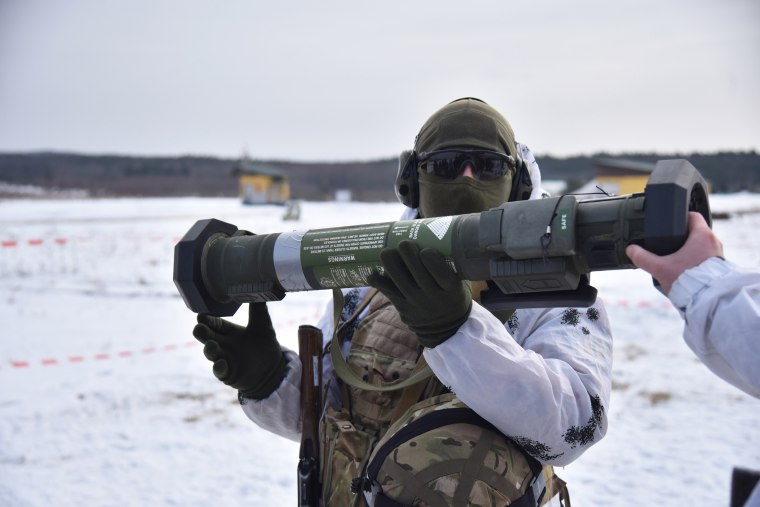 A Ukrainian military demonstrates the American grenade