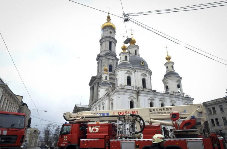 Fire trucks near the Dormition Cathedral after shelling by Russian forces of Constitution Square in Kharkiv, Ukraine, on March 2, 2022.