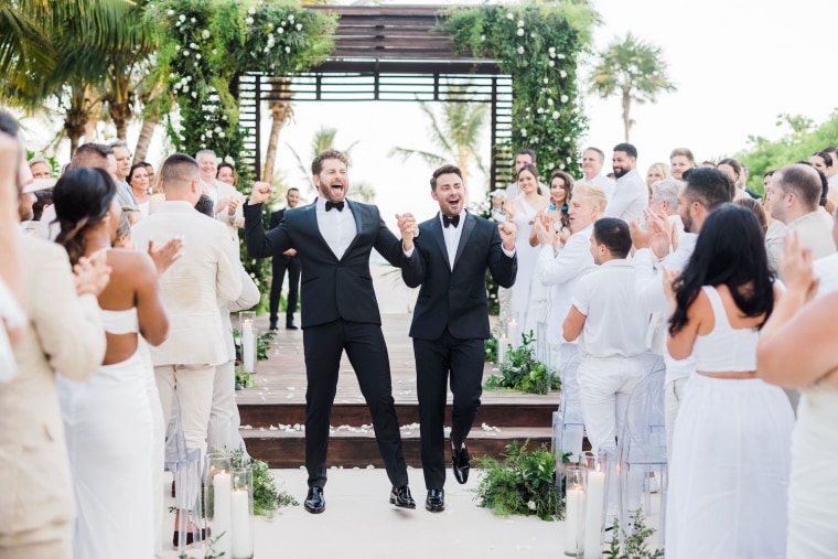 Bennett, right, and his new husband, television host Jaymes Vaughan, tied the knot in Mexico in front of more than 100 of their loved ones.
