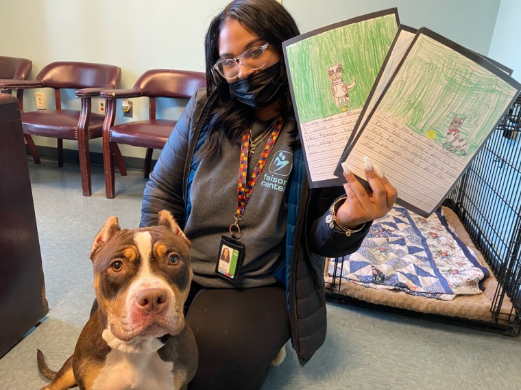 Everyone who adopted a dog that came with an essay and drawing from St. Michael's Episcopal School students got to take it home with them and their new furry friend.
