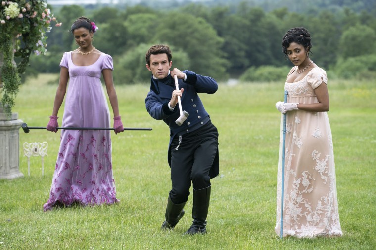 Pictured, l-r: Simone Ashley as Kate Sharma, Jonathan Bailey as Anthony Bridgerton, Charithra Chandran as Edwina Sharma in episode 203 of "Bridgerton."