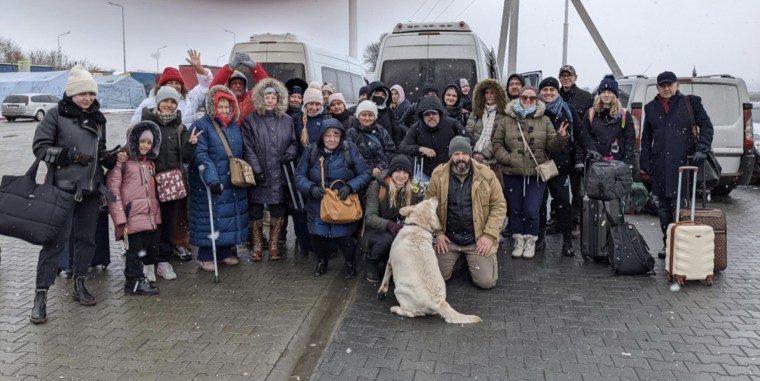 Bryan Stern pictured with refugees he was able to help safely evacuate from Kyiv. Stern said Project Dynamo is rescuing cats and dogs, too.